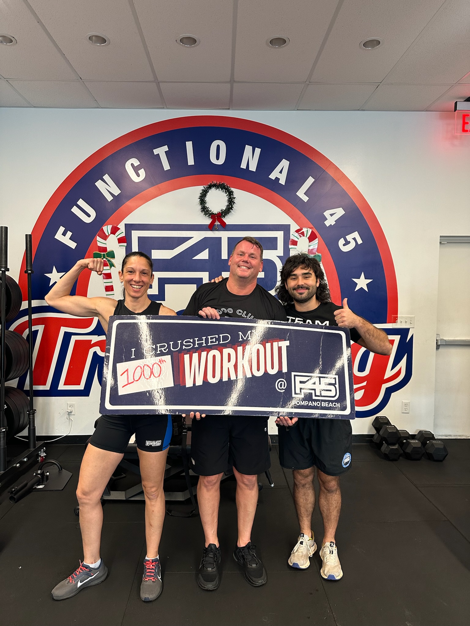F45 Pompano members celebrating a workout milestone